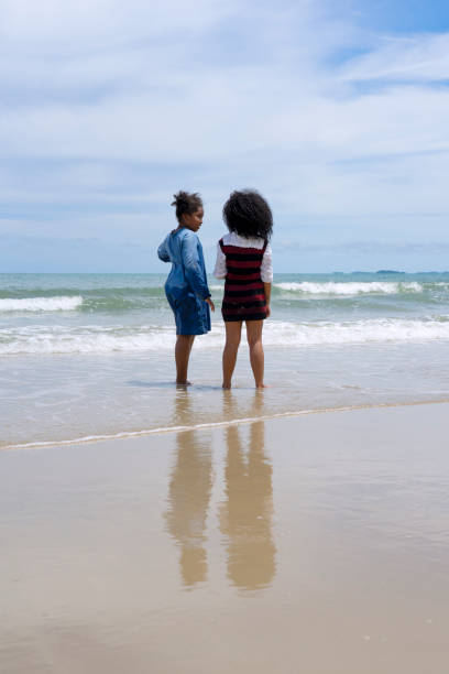 istock Kids are playing on the beach. 1404337187