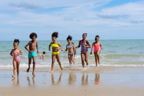 istock Kids are playing on the beach. 1404337222