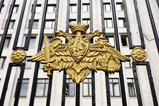 Double-headed eagle on the metal fence, symbol of russian military