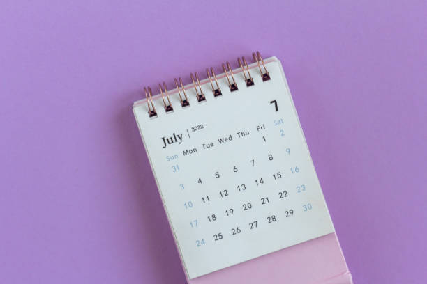 istock Desktop calendar for July 2022 on a lilac background., 1404339697