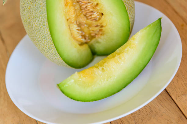 istock a piece of fresh green melon in dish 1404343632