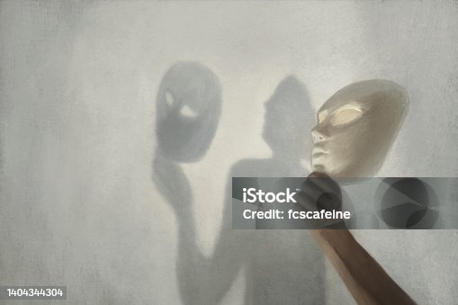 istock surreal shadow on the wall of a person who takes off the mask from his face, concept of truth and fiction 1404344304