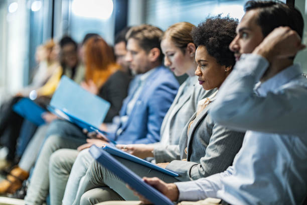istock Large group of business people waiting for a job interview. 1404344954