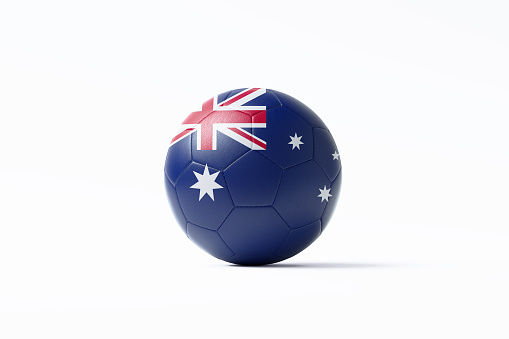 Soccer ball textured with Australian flag sitting on white background. Horizontal composition with copy space. Clipping path is included.