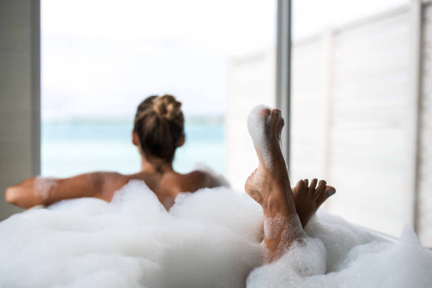 istock Close up of woman's feet in bubble bath. 1404347245