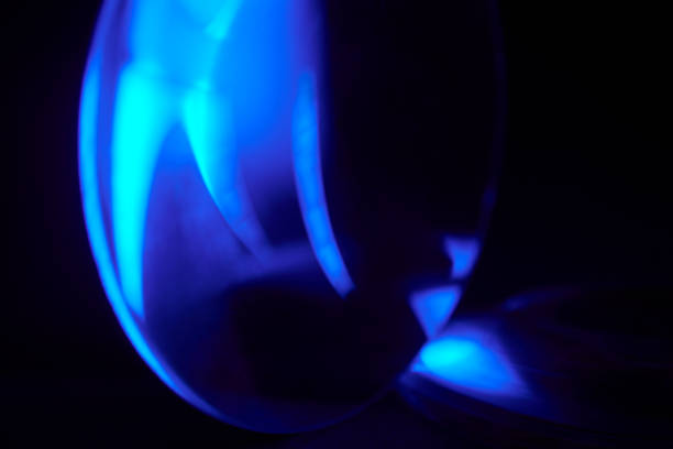 istock Enlarger condensor glass multicolored lights abstract background 1404347861