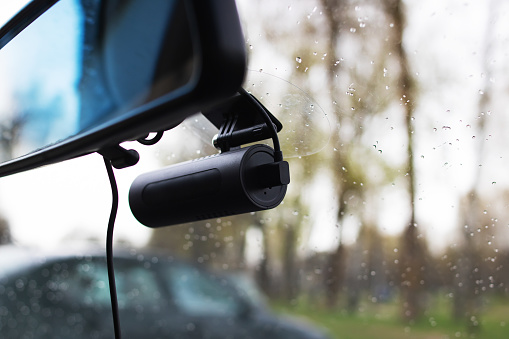 DVR camera on the windshield of the car close up