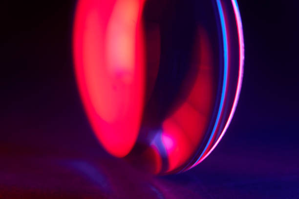 istock Enlarger condensor glass multicolored lights abstract background 1404348092