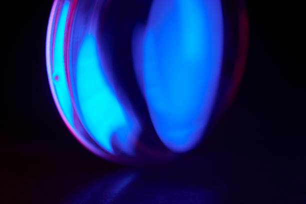 istock Enlarger condensor glass multicolored lights abstract background 1404348096