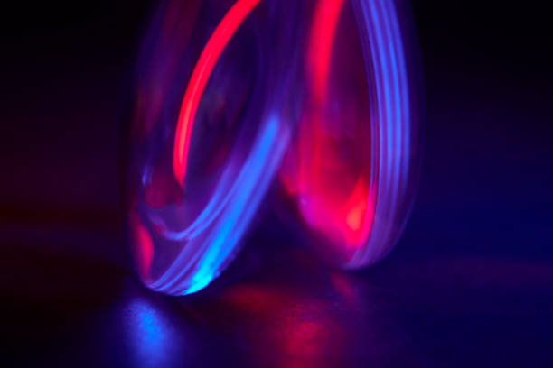istock Enlarger condensor glass multicolored lights abstract background 1404348098