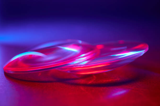 istock Enlarger condensor glass multicolored lights abstract background 1404348102