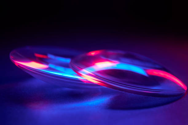 istock Enlarger condensor glass multicolored lights abstract background 1404348105
