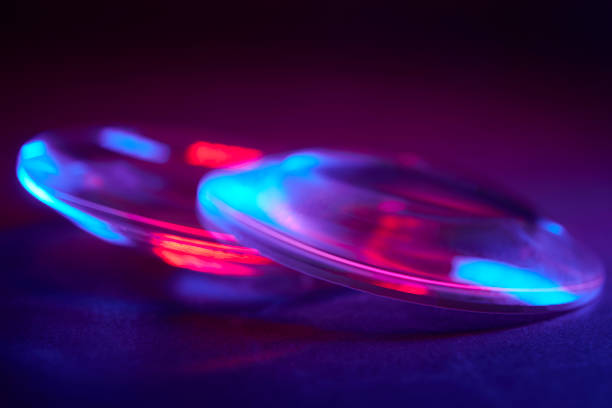 istock Enlarger condensor glass multicolored lights abstract background 1404348155