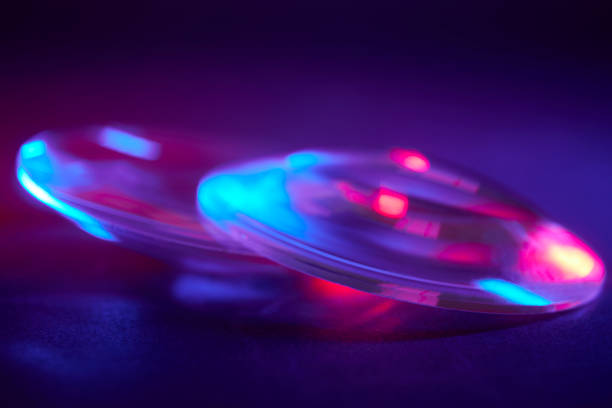 istock Enlarger condensor glass multicolored lights abstract background 1404348156