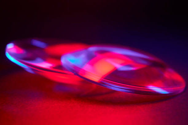 istock Enlarger condensor glass multicolored lights abstract background 1404348160