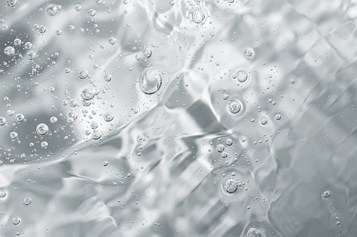 Primer plano macro Gel de aloe vera textura cosmética fondo con burbujas. photo