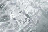 Close up macro Aloe vera gel cosmetic texture background with bubbles.