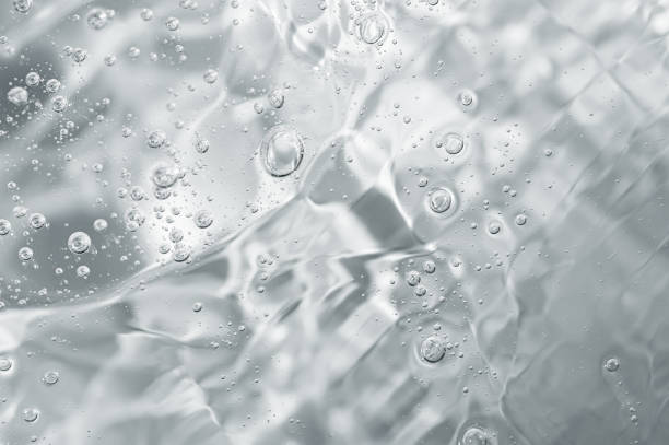close up macro aloe vera gel cosmetic texture background with bubbles. - hårgelé bildbanksfoton och bilder