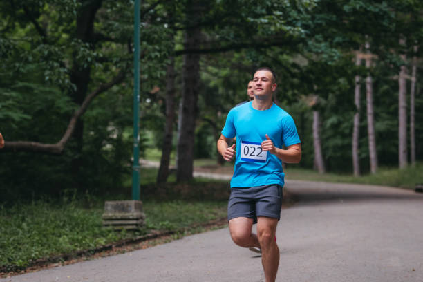 istock A young runner on a track in nature. Closeup. 1404350214