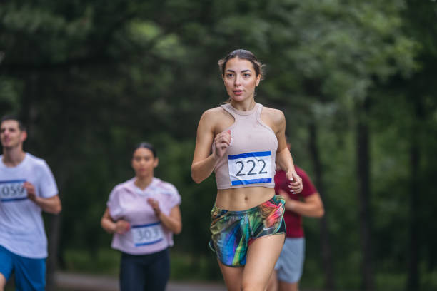 istock A young runner on a track in nature. Closeup. 1404350235