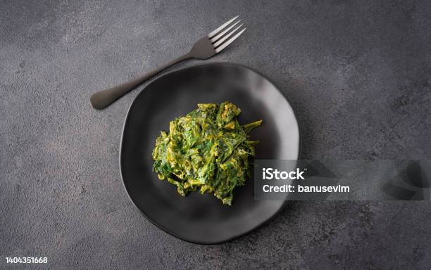 Spinach With Egg On Black Plate Stock Photo - Download Image Now - Salad, Wakame, Algae