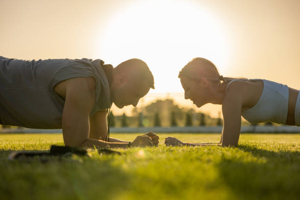 istock Dedicated couple, together exercising in the nature during sunset 1404351937