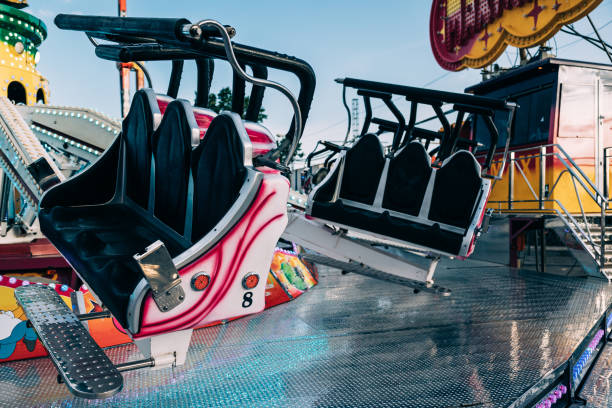 Empty attraction seats in the amusement park.