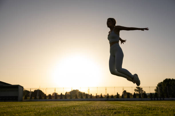 istock Active woman exercise on the soccer field during sunset 1404358450