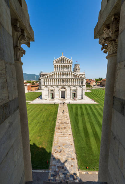 Cathedral and Leaning Tower of Pisa in Piazza dei Miracoli - Tuscany Italy Cathedral (Duomo of Santa Maria Assunta) and the Leaning Tower of Pisa, Piazza dei Miracoli (Square of Miracles), view from the Battistero di San Giovanni (Baptistery of Saint John in Romanesque Gothic style, 1152-1390). UNESCO world heritage site, Tuscany, Italy, Europe. pisa leaning tower of pisa tower famous place stock pictures, royalty-free photos & images