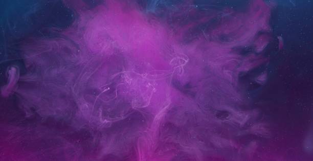 istock color fluid mix smoke cloud motion purple blue ink 1404359162