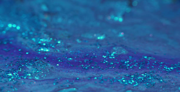 istock Glitter fluid acrylic paint motion blue liquid paint 1404359208