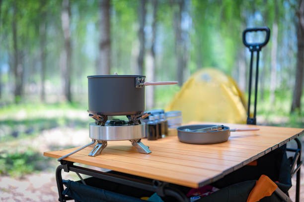 small camping gas stove and small pot stock photo
