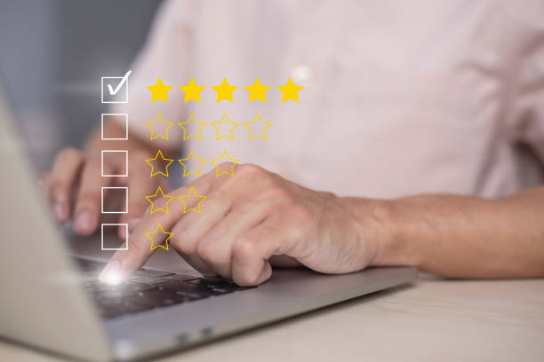 istock Satisfaction and customer service survey concept, business people using  laptop. to answer the questionnaire And the satisfaction rating, the satisfaction rating with the  icon 5 stars. 1404360931