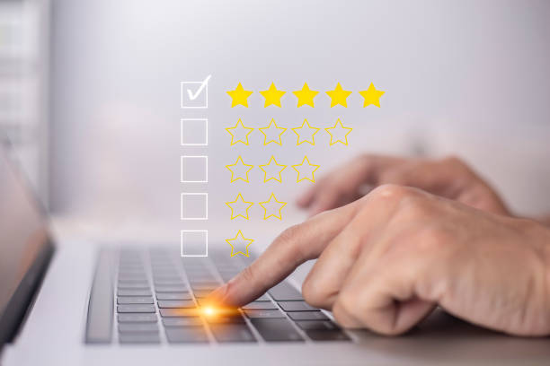 istock Satisfaction and customer service survey concept, business people using  laptop. to answer the questionnaire And the satisfaction rating, the satisfaction rating with the  icon 5 stars. 1404360936