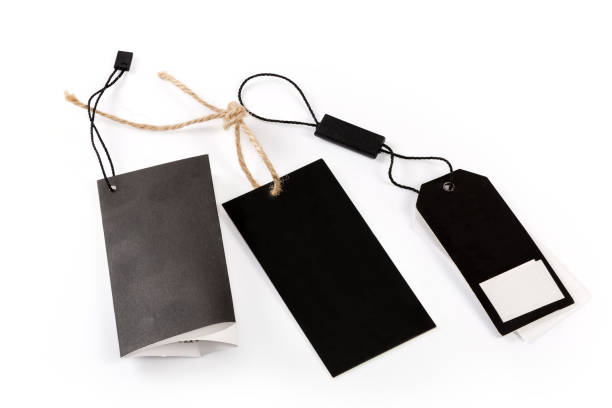 istock Different blank paper clothing swing tags on the ropes 1404364999
