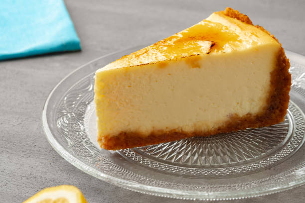 istock Piece of lemon cheesecake on glass dish 1404365091