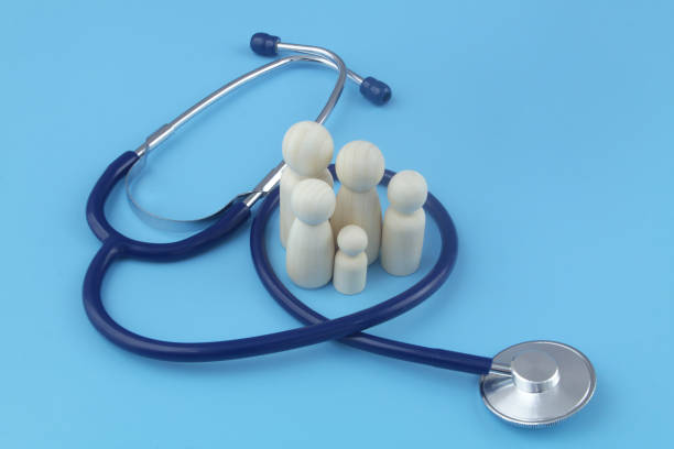 istock Family people figures with stethoscope on blue background close-up. 1404366522
