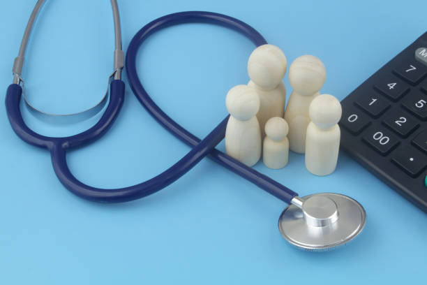 istock Family people figures with calculator and stethoscope on blue. 1404366632