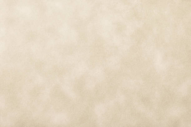 istock Texture of light brown old paper, crumpled background. Vintage beige grunge surface backdrop. 1404367238
