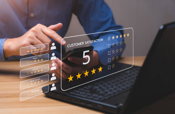 istock Customer satisfaction concept. Hands of a business man using a smartphone to comment 5 stars. Excellent business rating experience. Satisfaction Rating, good and impressive 1404367578