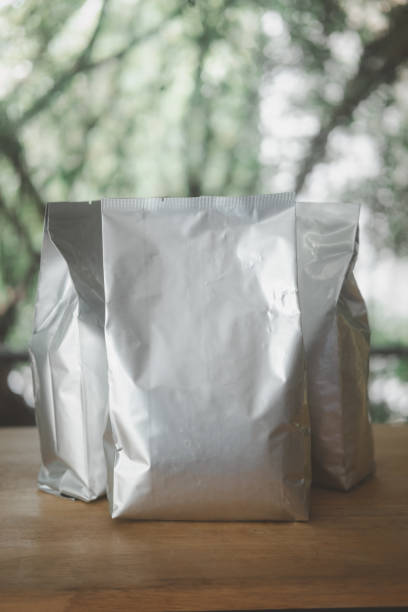 istock Foil paper bag package of coffee beans. 1404369247
