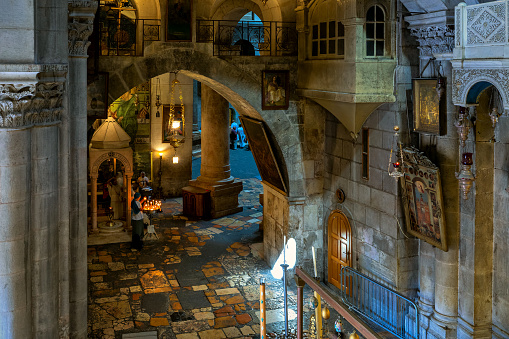Jerusalem, Israel - July 14, 2019: People inside of the Church of the Holy Sepulcher in Old City of Jerusalem - sacred place for christians were Jesus Christ was crucified and buried.