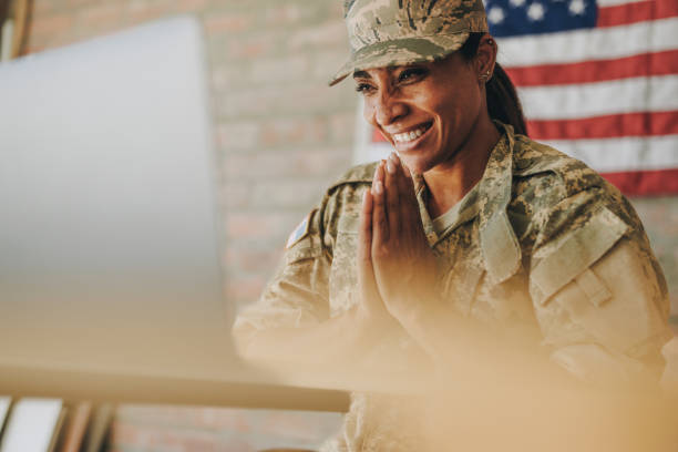 istock Cheerful servicewoman video chatting with her family 1404371164