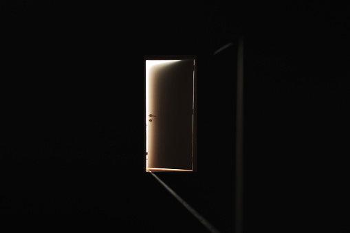 Door to the light in a dark