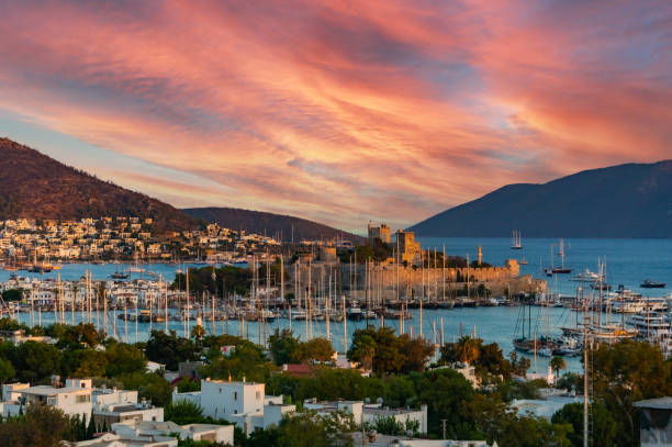 View of the bay of Bodrum, in the center is the castle of St. Peter. View of the marina of Bodrum, in the center is the castle of the hospitallers. Evening sky. Sunset. bodrum stock pictures, royalty-free photos & images