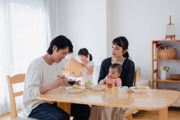 istock Families around the table with their children 1404378229