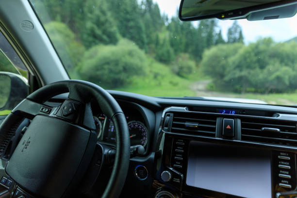 istock Driving off road car in the summer forest mountains 1404380537