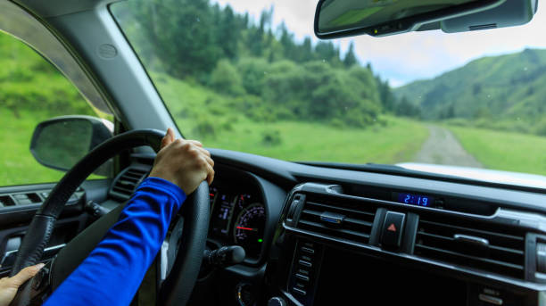 istock Driving off road car in the summer forest mountains 1404380560
