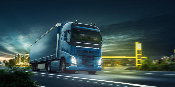 istock Truck at night on the road 1404380618