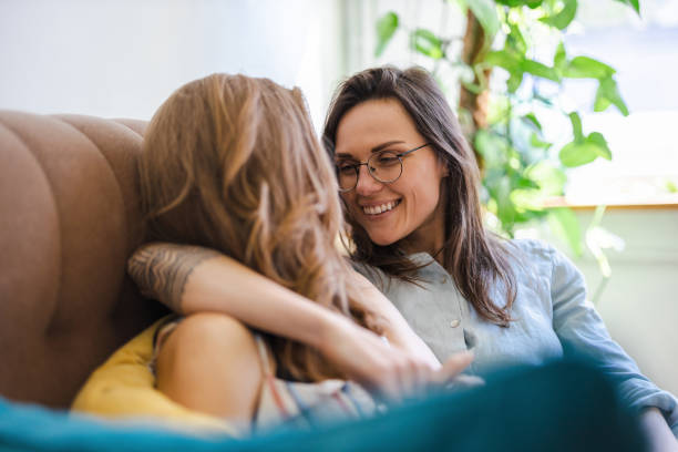 istock Happy affectionate lesbian couple at home 1404382355